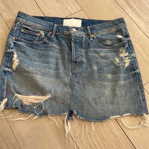 Mini Jean skirt. Distressed with patchs on it